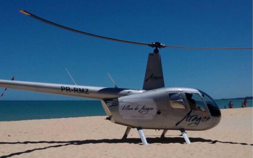 Helicóptero particular faz pouso forçado perto de banhistas em praia de Porto Seguro